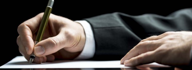 Businessman Writing A Letter Or Signing